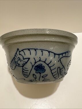 Eldreth Pottery bowl. Cat in blue, playing among flowers.  Made in 1995.